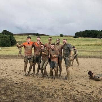 staff taking part in the Yorkshire Tough Mudder event