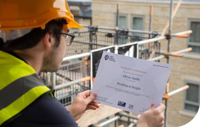 Person reading working at height certificate