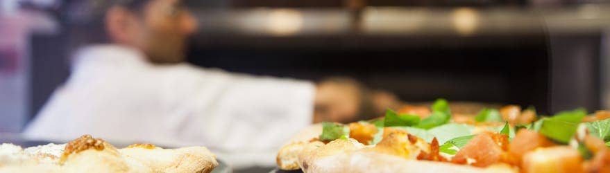 Pizzas being cooked in restaurant oven