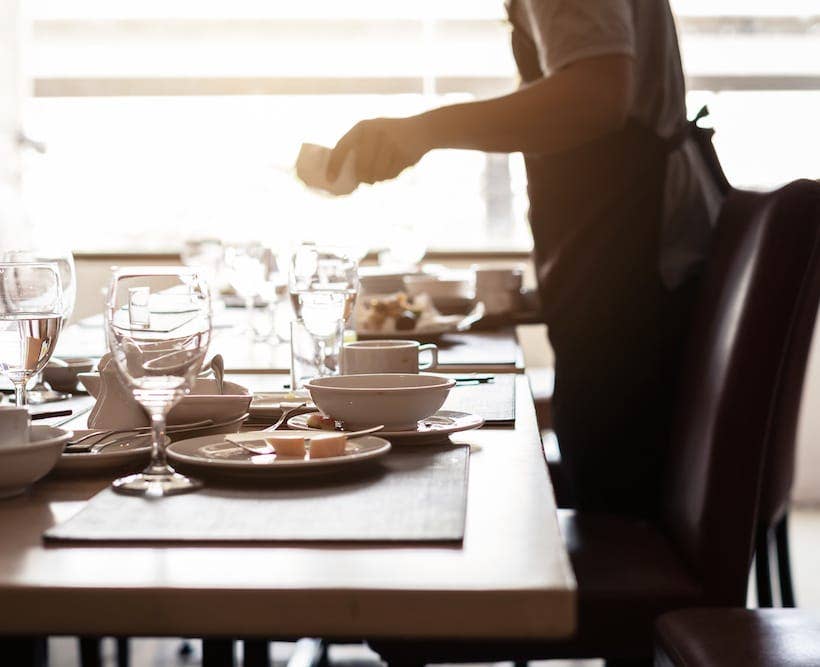 Waiter Clearing a table