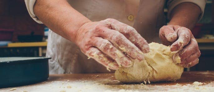 baker kneading dough