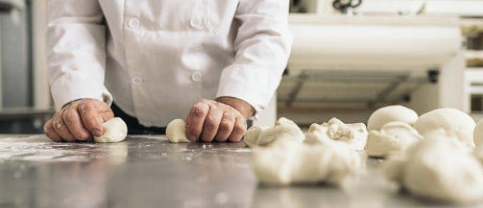 baker preparing food in a kitchen 