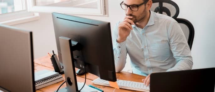 Man on computer assessing personal data