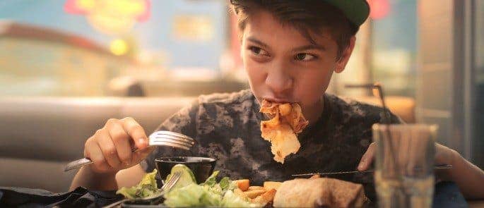 Teenager Eating Healthy Fast Food