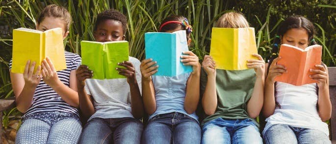 Children sat reading books