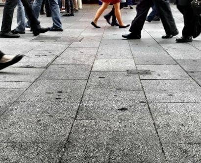 image of people walking on the pavement