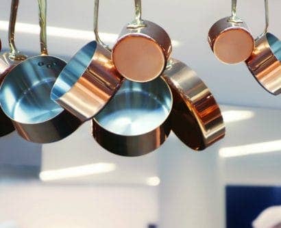 Pans hanging up in a restaurant kitchen