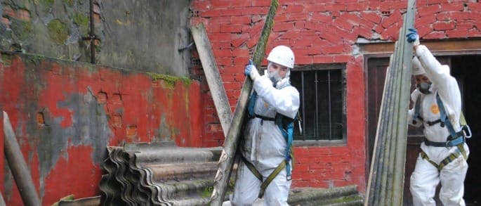 asbestos protection man removing asbestos