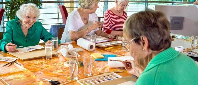 Care home patients engaging in social activities