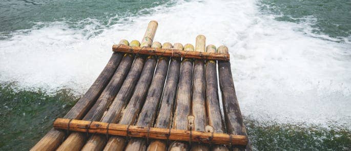 A bamboo life raft on choppy waters
