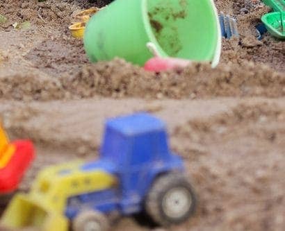 child's sandpit with toys