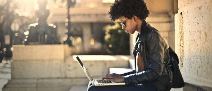 girl doing job application on laptop