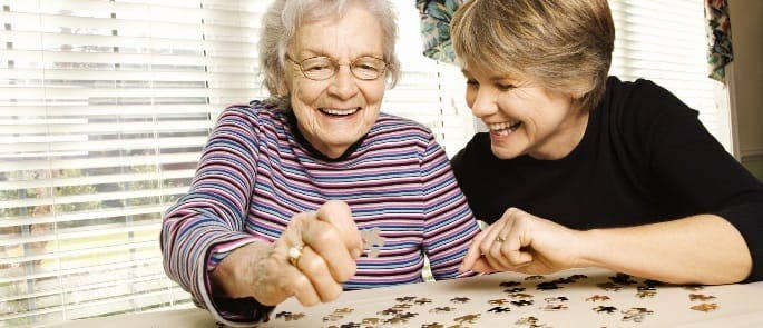 carer and patient doing a jigsaw