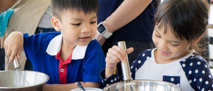 children cooking food in class