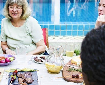 diverse family enjoy meal