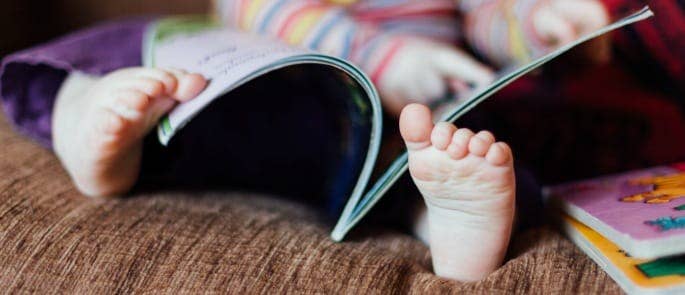 A little girl being read to