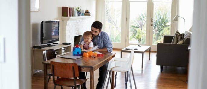 Father reading to his child for social development