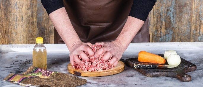Chef mincing ground beef