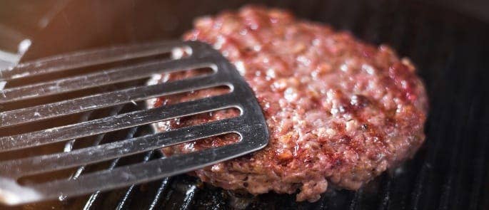 Cooking a medium cooked burger on a grill