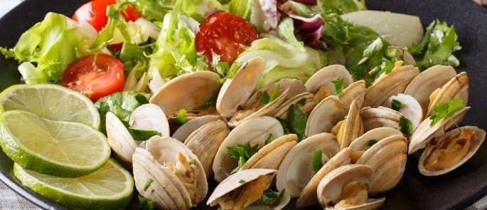 A salad served with clams