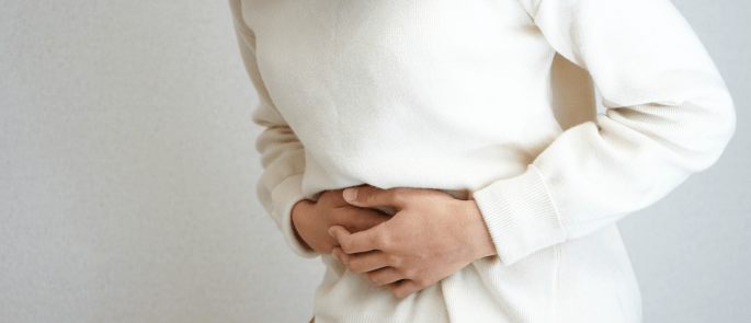 person suffering stomach ache due to food poisoning 