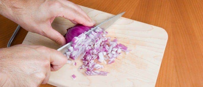 chef chopping onions