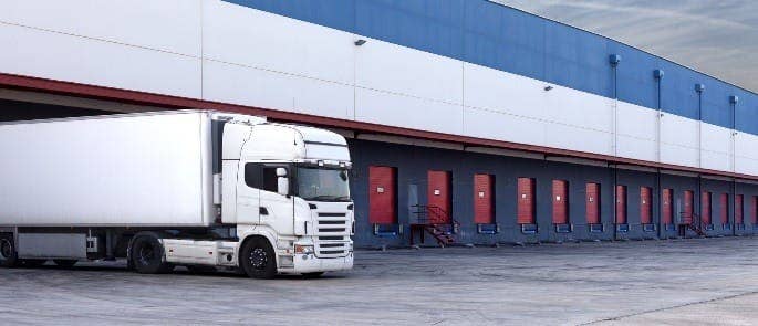 Loading a large white cargo lorry