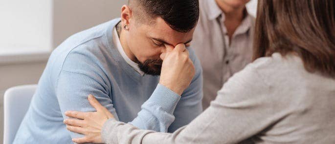 A stressed man in counselling