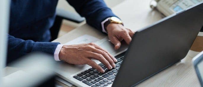 Employee completing elearning on laptop