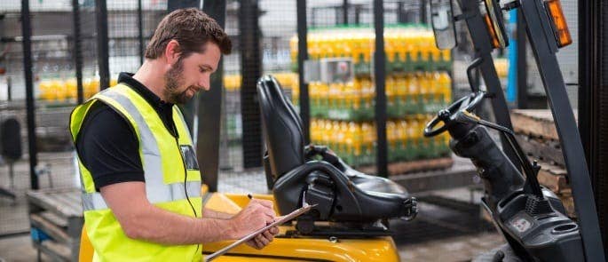 Responsible person inspecting work warehouse vehicle