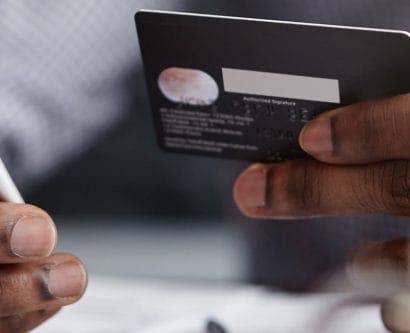 man doing a mobile purchase with credit card