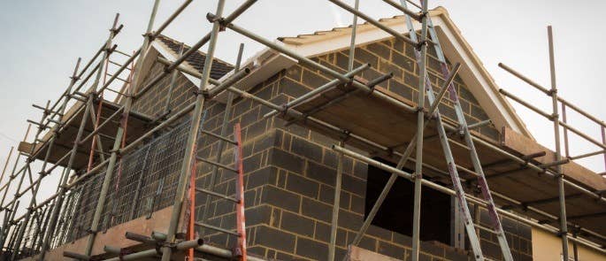 House with ladders and scaffolding