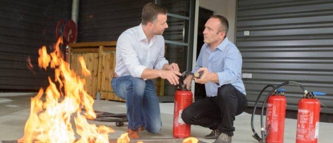 two colleagues undertaking fire warden training