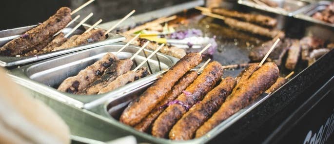 meat skewers at a street food stall