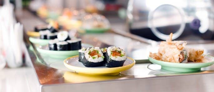 A sushi conveyor belt in a restaurant