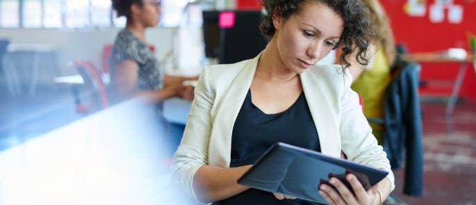 Teacher using tablet to access data