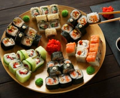 sushi on a board in a restaurant