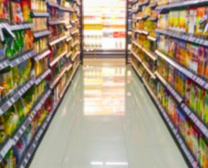 supermarket aisle with labelled products