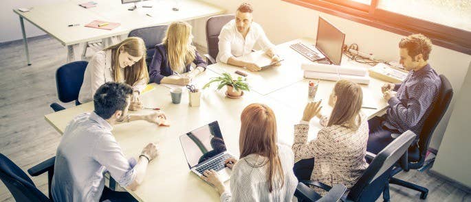 Colleagues communicating in a company meeting