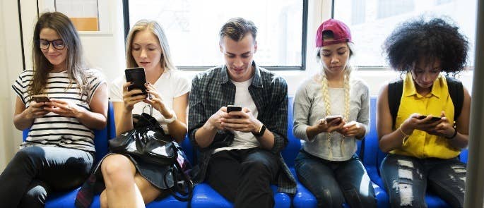 Group of sixth form students on their phones