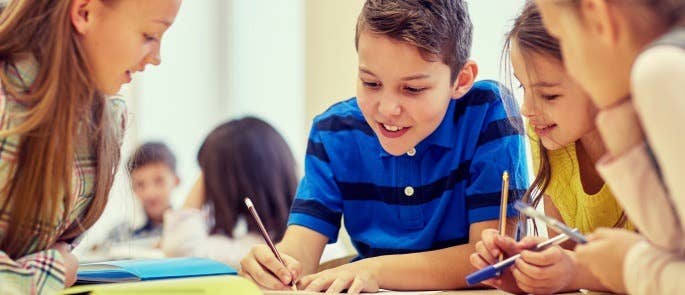 Children in a school working on a project together