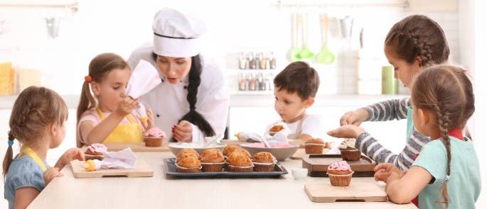 School Children Baking with their Teacher