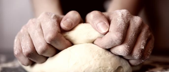 chef kneading dough