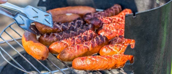 Reheating sausages on a barbecue