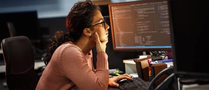 A female web developer coding at work