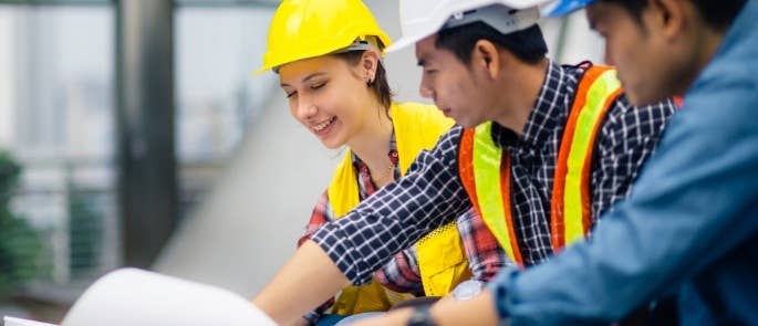 Contractors checking a plan