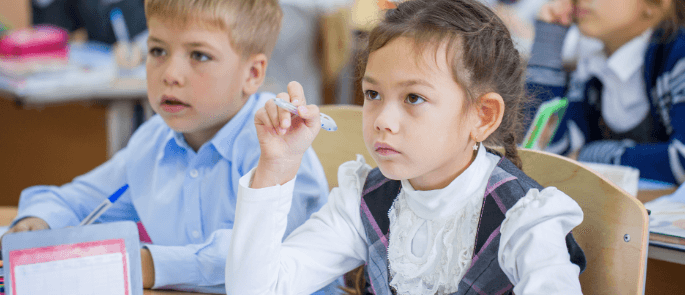 Young girl in school concentrates