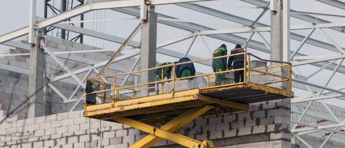 Workers on mobile elevated work platform