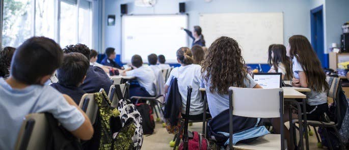 Students studying in school classroom