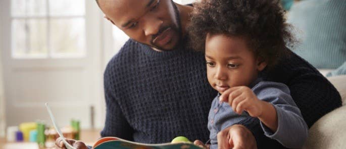 A father reading with his daughter